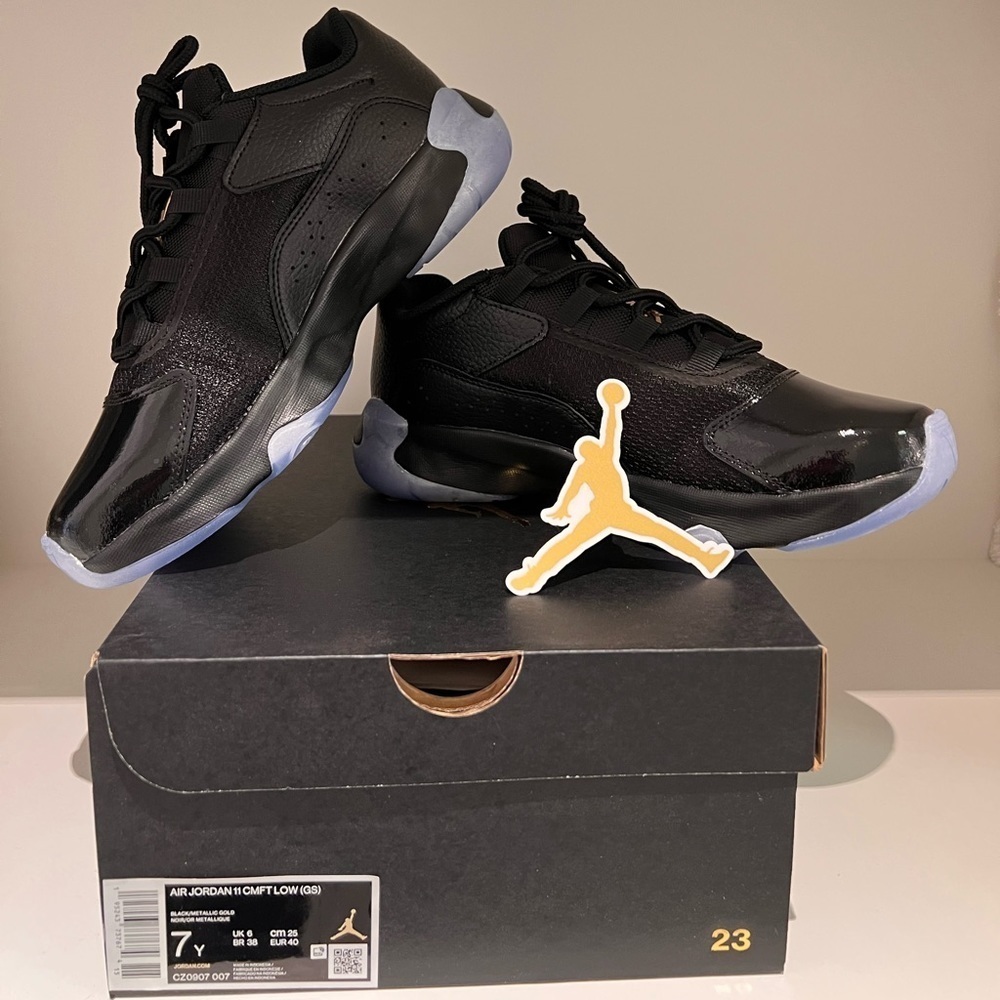 Air Jordan 11 CMFT, size 7Y, will fit size 7 woman.